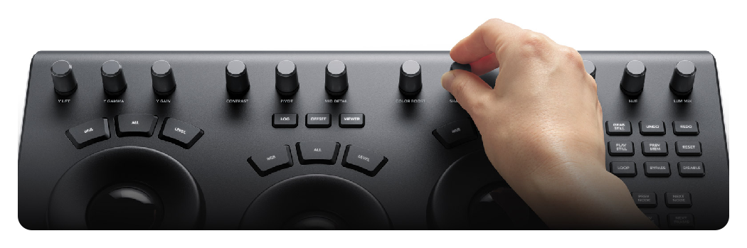 hand adjusting the controls of the DaVinci Resolve Micro Panel, Blackmagic Design DaVinci Resolve Micro Color Panel